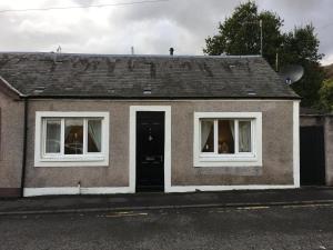 a small house with two windows and a door at 123v Tillicoultry Holiday let in Tillicoultry