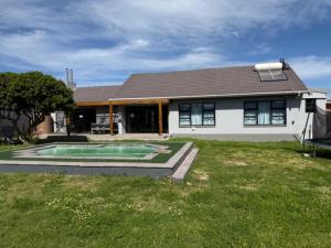 a house with a swimming pool in the yard at Silva Dolphin in Vredenburg