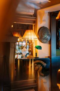 a kitchen with a table with a lamp on it at Bella View Art Boutique Hotel in Kyrenia
