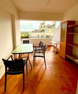 a room with a table and chairs and a window at Carisa rooms for holiday in Larnaca +11 photos