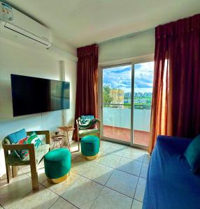 a bedroom with a large window with a view at Carisa rooms for holiday in Larnaca