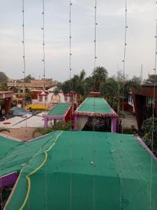 a playground with green and green play equipment at Virat Palace in Deoghar +28 photos