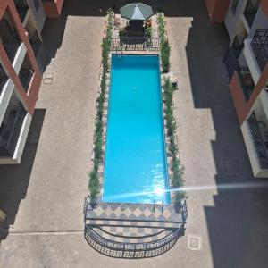 an overhead view of a swimming pool in a building at Spacious Studio Apartment with Swimming pool in Nairobi