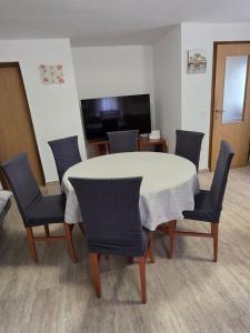 a dining room with a table and chairs at House Belavici in Hreljići