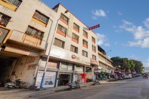 a building on the side of a street at Hotel Sayba Inn - Budget Stay! in Pune