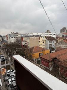 a view of a city from a balcony at AG Apartman in Kraljevo