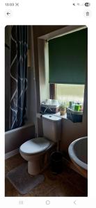 a bathroom with a toilet and a sink at Orkney,Shapinsay in Kirkwall +9 photos