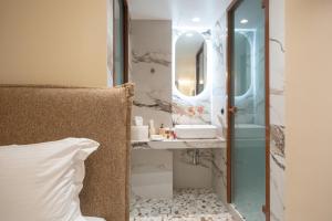 a bathroom with a sink and a mirror at Athens Retro in Athens +111 photos