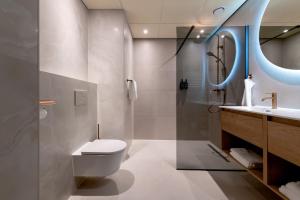 a bathroom with a toilet and a sink at Gelk in Groningen