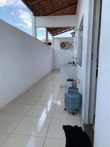 a bathroom with a water tank on the floor of a building at Green House Apartamentos in Ubá +55 photos