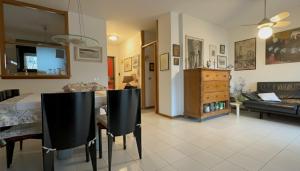 a living room with a table and chairs and a couch at Taormina Sky View in Taormina