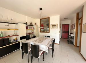 a kitchen with a table and chairs in a room at Taormina Sky View in Taormina +5 photos