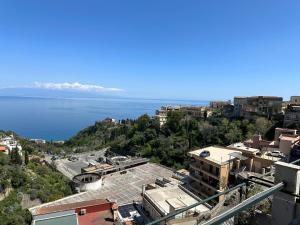an aerial view of a city and the water at Taormina Sky View in Taormina