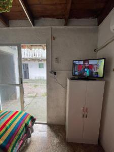 a tv sitting on top of a cabinet in a room at Inactivo in Chuy