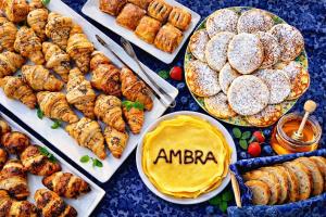 a table topped with plates of food and pastries at HOTEL AMBRA - Fronte Mare - Vicinissimi al Centro in Milano Marittima +66 photos