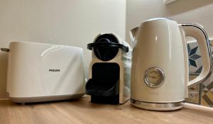 two appliances sitting on top of a wooden counter at le Roy de coeur in Riquewihr