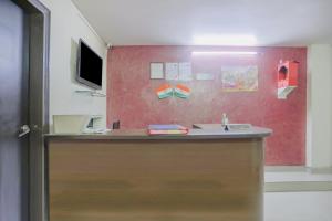 a bathroom with a counter with a sink at Collection O Green Park Residency 3 in New Delhi