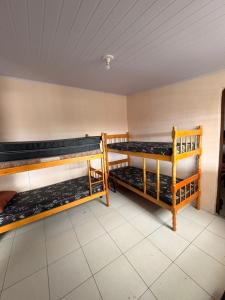a room with two bunk beds in it at Chácara Pagliai e Bueno in Suzano +23 photos