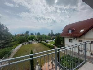 a view of a yard from a balcony of a house at Anton Apartmanház in Balatonfüred