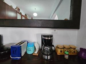a kitchen counter with a blender on a table at Petrit apartament in Qeparo