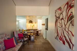 a hallway with a living room and a dining room at Pousada da Villa in Fernando de Noronha