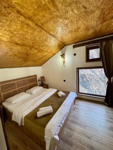 Llit o llits en una habitació de Ojakh Resort