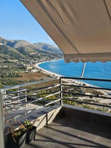 a balcony with a view of the ocean at Rafa's Apartament in Himare