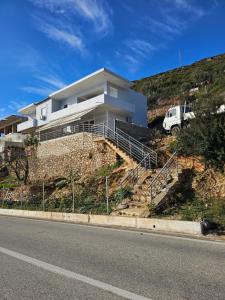 a house on the side of a hill at Rafa's apartment in Qeparo