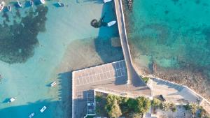 an aerial view of a house on the beach at Hotel Lo Scoglio in Porto Cesareo
