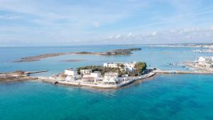an island in the middle of the water at Hotel Lo Scoglio in Porto Cesareo