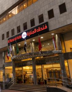 a building with a sign on the front of it at Al Manara Ewaa Hotel in Mecca