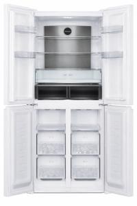 an empty refrigerator with its doors open on a white background at סוויטת גן ליד הים in Qiryat Yam