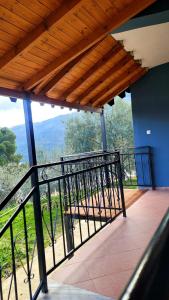 a balcony with a view of the mountains at Rama Guest House in Berat
