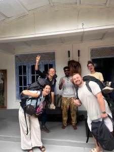 a group of people posing for a picture at Ella Ceylon Homies Hostel in Ella