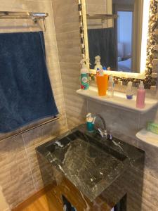 a bathroom with a sink and a mirror at Sky bed in Madinaty +11 photos