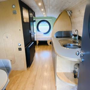 a small bathroom with a sink and a toilet at Highland Gateway Glamping in Clackmannan