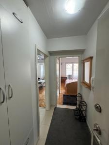 a room with a hallway with a bed and a door at Apartman Harmony in Ohrid