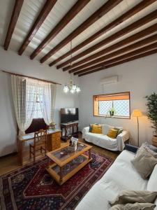 a living room with a couch and a table at Casa Antigua Arona in Arona