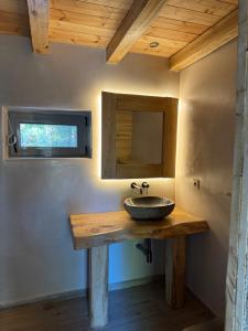 a bathroom with a sink on a wooden table at Cedar Wood Cabin in Áno Polídhrosos +32 photos