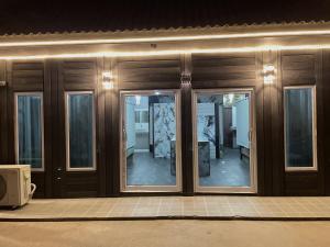 a front door of a building with glass windows at Dream Moon Hostel in Haad Rin