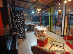 a living room with a table and a dining room at Valle Hermoso Salta in Salta
