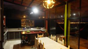 a kitchen with a table and chairs and a counter at Valle Hermoso Salta in Salta