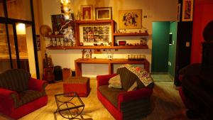 a living room with two chairs and a couch at Valle Hermoso Salta in Salta