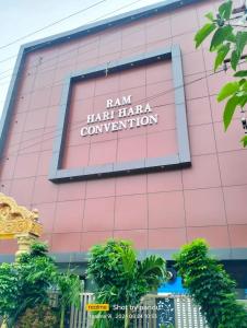 a pink building with a sign that reads ham ham haka convention at Ram Hari Hara Convention in Khammam