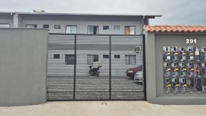 a garage door with a bunch of wine bottles at Loft mobiliado in Joinville
