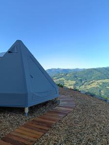a blue umbrella sitting on top of a wooden deck at La Torre in Pavullo nel Frignano