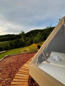 a man standing on a bed on a deck at La Torre in Pavullo nel Frignano