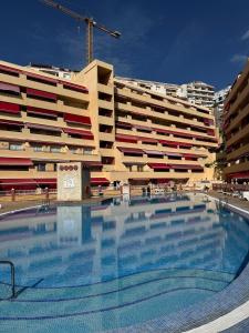 a large swimming pool in front of a building at Casa de Rufio With Pool Tenerife in Puerto de Santiago