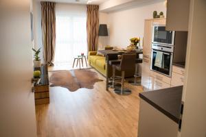a living room with a kitchen and a dining room at Rosaliya in Cochem