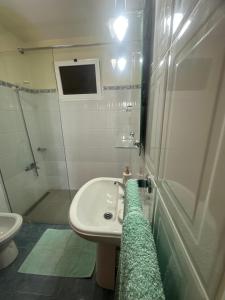a bathroom with a sink and a shower and a toilet at Elisabeth House in Ponta do Sol +26 photos